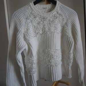 decorated white sweater